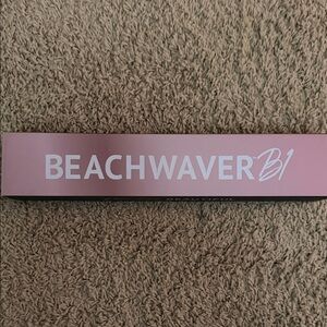 The Beachwaver B1 automatic rotating curling iron.